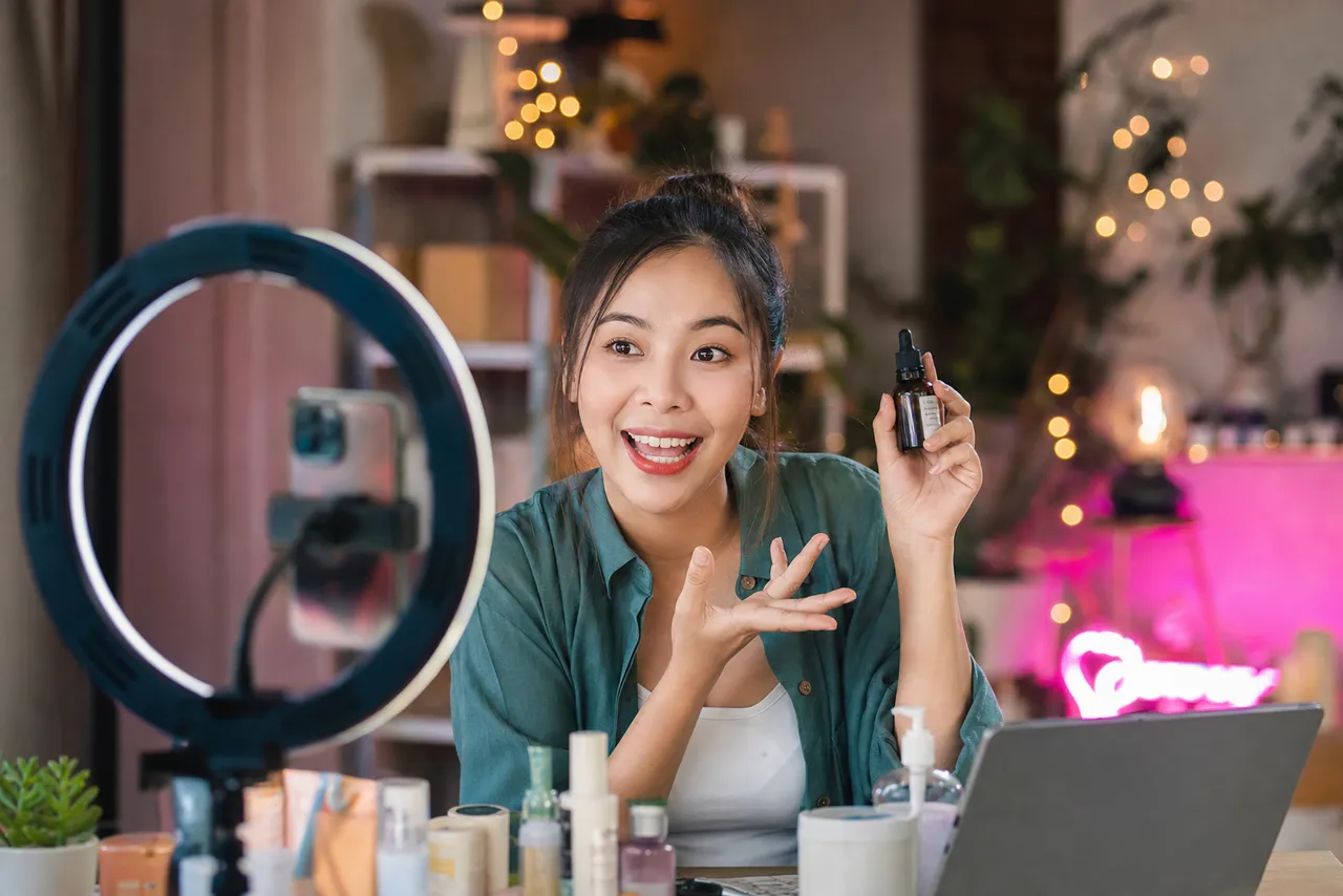 Creator going live on camera presenting a product with a ring light